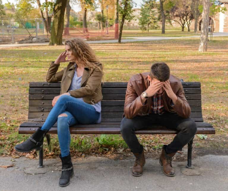 A couple fighting on a park bench in NYC